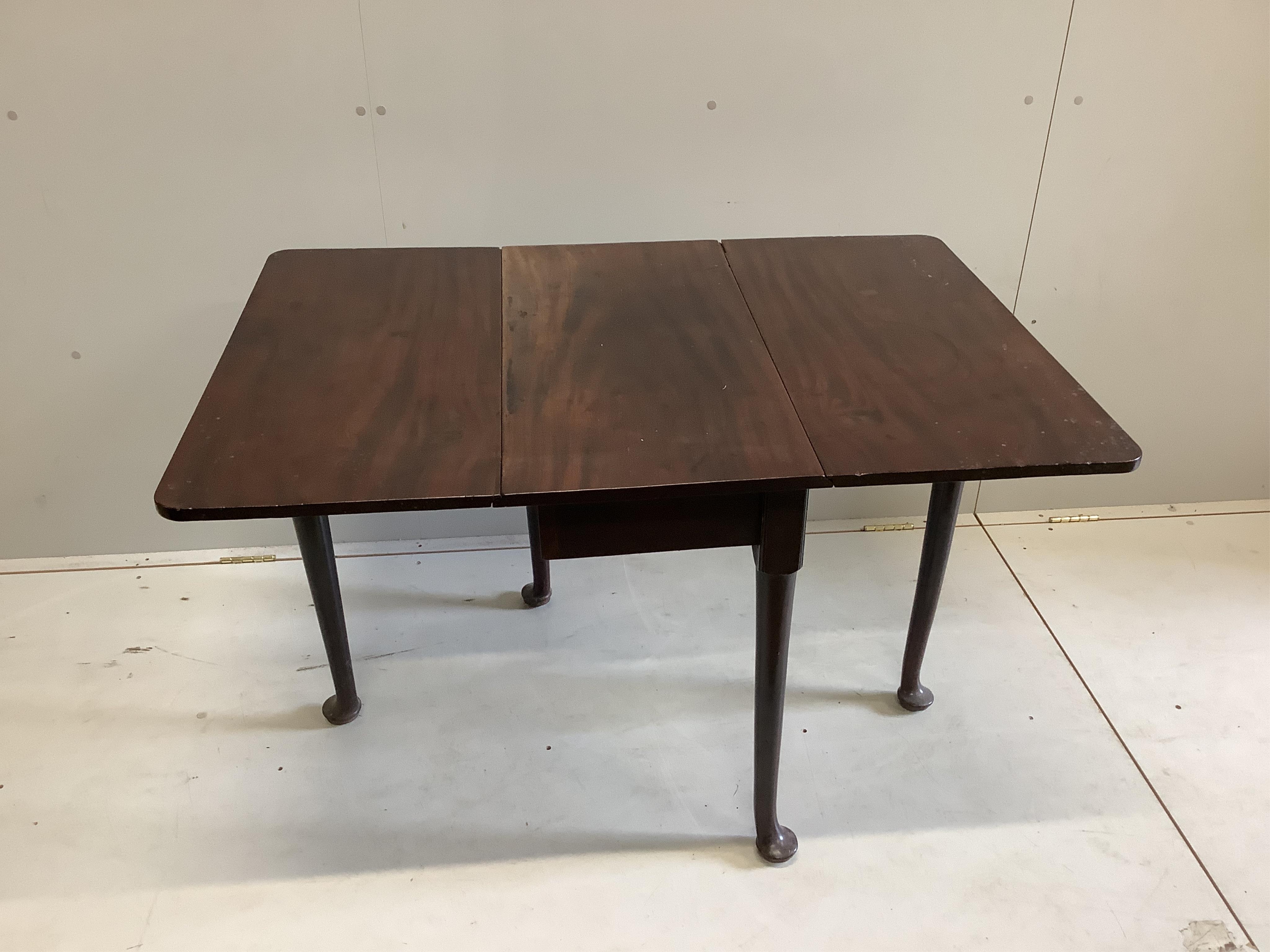 A George III mahogany drop leaf pad foot dining table, width 78cm, depth 40cm, height 71cm. Condition - fair